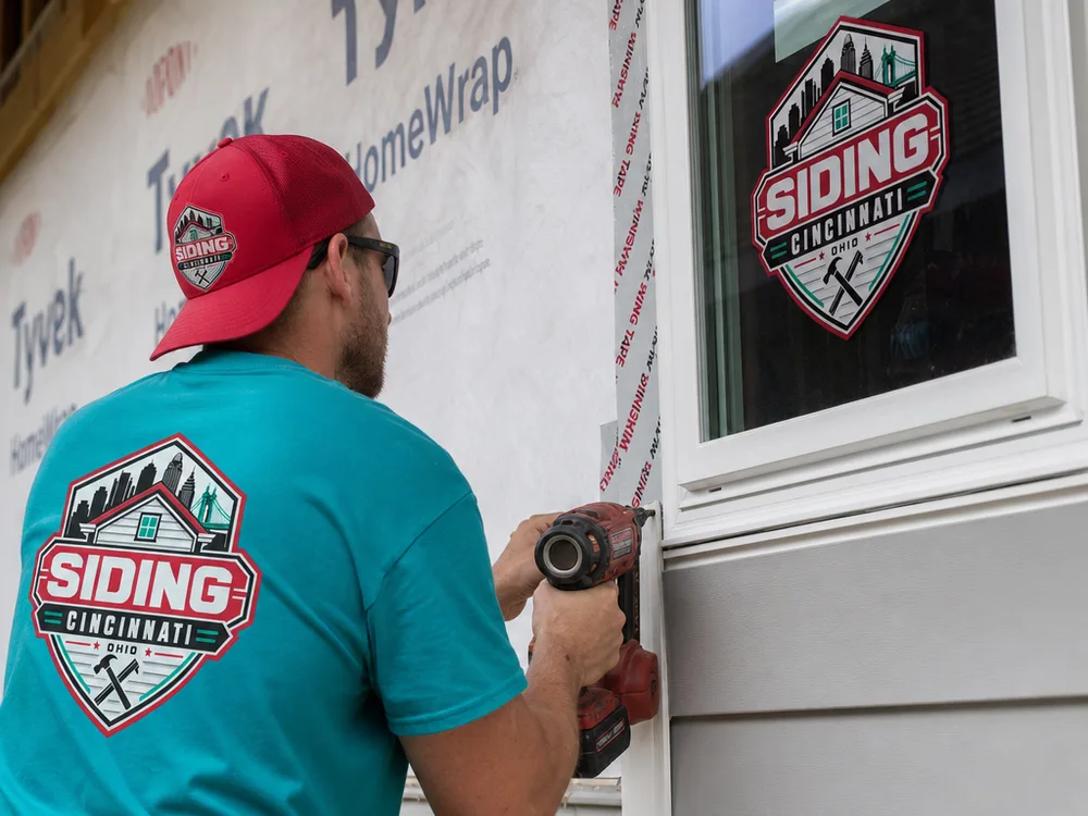 Close-up of new siding installation showing water-resistive barrier, integrated window flashing tape, and a clean trim transition